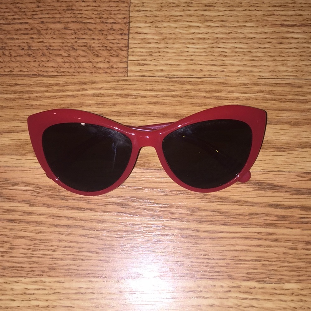 Red Tory Burch sunglasses.